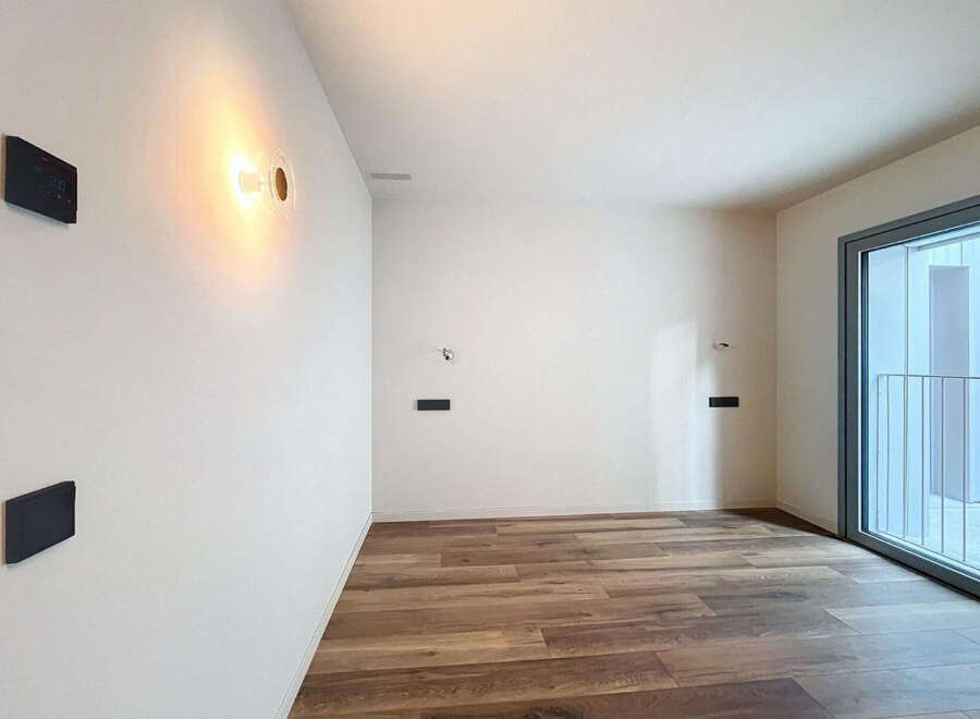 This stunning property boasts a modern, minimalist design with sleek hardwood floors and large windows that flood the space with natural light.