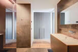 Luxury bathroom with modern design features, including a sleek countertop sink and built-in storage.
