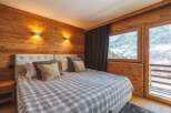 Experience the ultimate mountain retreat in this cozy bedroom.