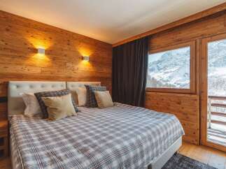 Experience the ultimate mountain retreat in this cozy bedroom.