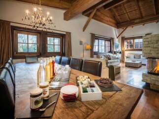 Experience luxury in this stunning property, featuring a spacious dining area perfect for gatherings.