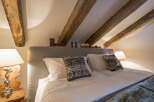 Experience rustic charm in this cozy bedroom.