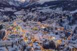 Discover the charm of this snow-covered village nestled in the mountains.