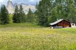 Escape to a charming wooden cabin nestled in a picturesque mountain landscape.