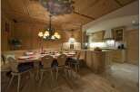 Experience rustic charm in this beautifully designed dining area, featuring warm wooden accents and a cozy atmosphere.