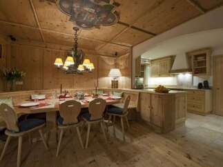 Experience rustic charm in this beautifully designed dining area, featuring warm wooden accents and a cozy atmosphere.