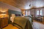 Experience rustic charm in this cozy bedroom.