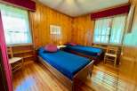Cozy bedroom with two twin beds, perfect for a relaxing getaway.