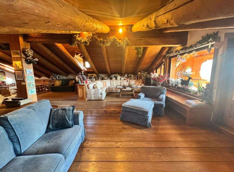 Step into a cozy and inviting living space with a rustic charm.