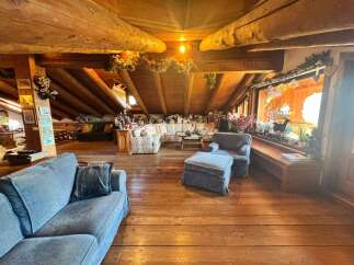 Step into a cozy and inviting living space with a rustic charm.