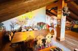 This charming property boasts a unique, rustic interior with exposed wooden beams and a cozy atmosphere.