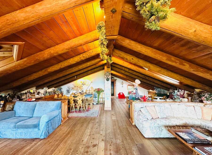 Discover the charm of this unique property featuring a stunning wooden beamed ceiling and a cozy living space.