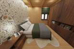 This cozy bedroom features a unique deer-themed wallpaper, creating a rustic and inviting atmosphere.