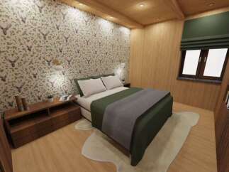 This cozy bedroom features a unique deer-themed wallpaper, creating a rustic and inviting atmosphere.