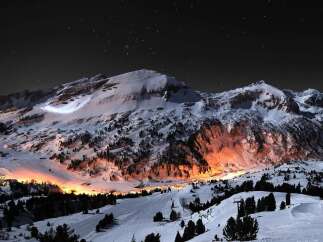 Experience the magic of a winter wonderland in this stunning nightscape.