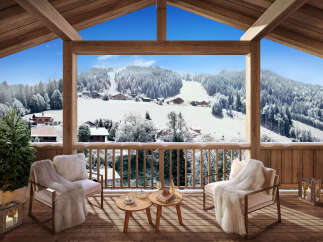 Cozy chalet balcony with stunning snowy mountain views.