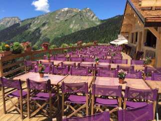 Enjoy breathtaking mountain views from this stunning outdoor dining area.
