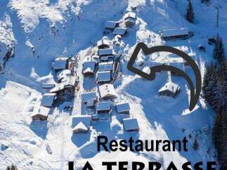 Discover the charm of Restaurant LA TERRASSE, nestled in a picturesque snow-covered landscape.