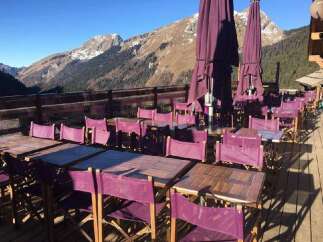 Enjoy breathtaking mountain views from this stunning outdoor dining area.