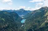 Nestled in a pristine mountain valley, this breathtaking property boasts stunning views of a crystal-clear lake and majestic peaks.