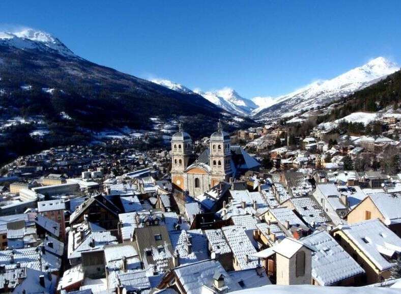 Discover the charm of this picturesque mountain town, nestled amidst snow-capped peaks.