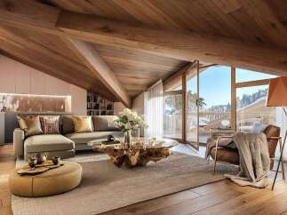 Luxurious chalet apartment boasting a stunning wooden beamed ceiling and expansive windows offering breathtaking mountain views.