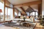 Luxurious chalet apartment boasting stunning mountain views and an open-plan living area.