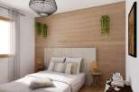 This bedroom boasts a serene atmosphere with its light color palette and natural wood accents.