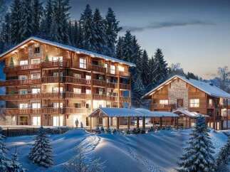 Luxury chalet apartments nestled in a snowy mountain setting.