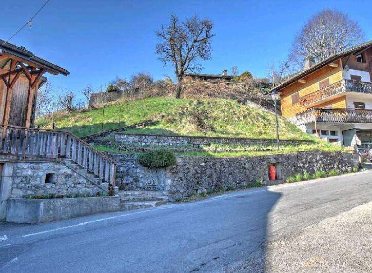 Mountain view lot with stone retaining wall and steps.