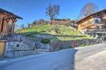 Mountain view lot with stone retaining wall and steps.