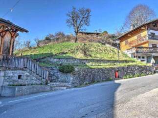 Mountain view lot with stone retaining wall and steps.
