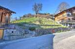 Mountain view lot with stone retaining wall and steps.