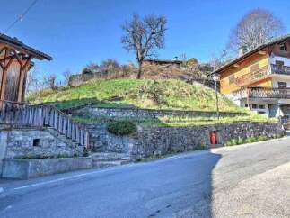 Mountain view lot with stone retaining wall and steps.