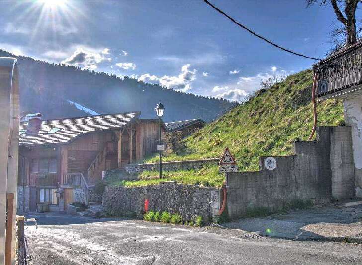 Charming wooden chalet nestled in the French Alps, offering breathtaking mountain views.