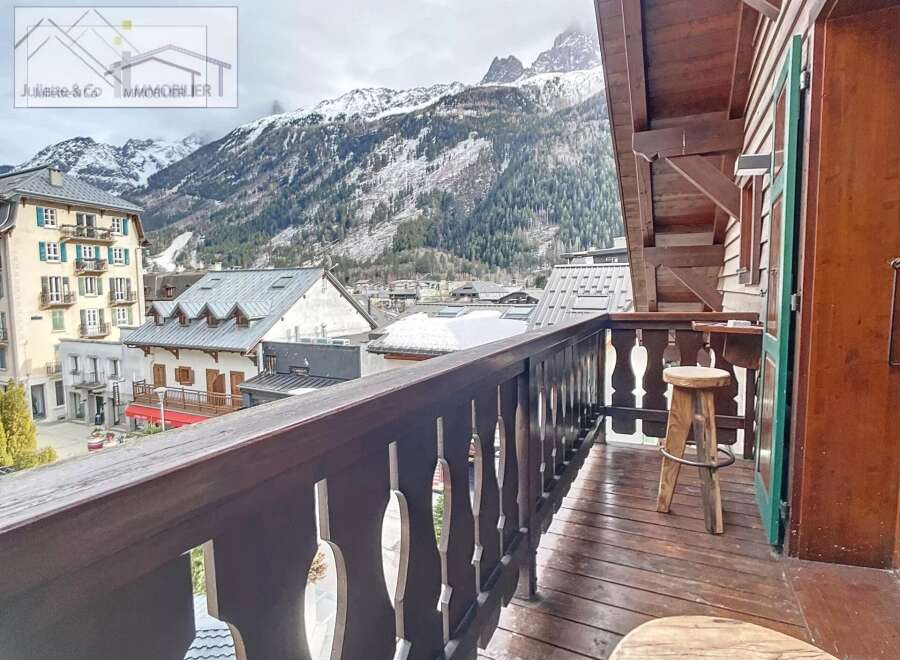 Enjoy breathtaking mountain views from this charming balcony.