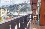 Enjoy breathtaking mountain views from this charming balcony.