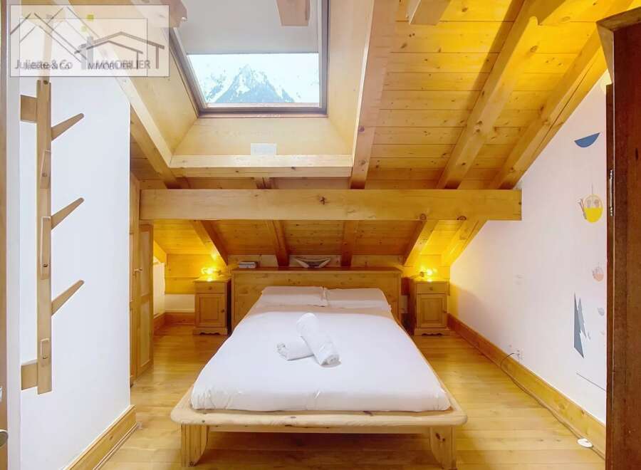 Discover a cozy bedroom retreat with a stunning mountain view.