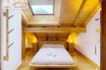 Discover a cozy bedroom retreat with a stunning mountain view.