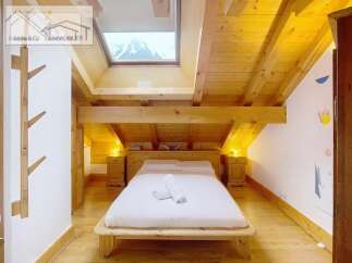 Discover a cozy bedroom retreat with a stunning mountain view.