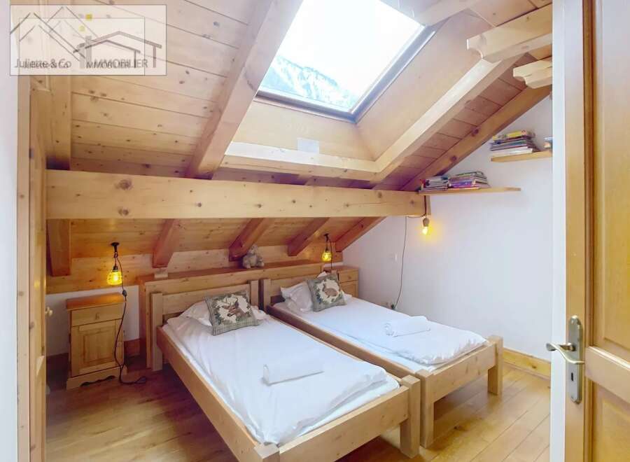 Discover a cozy bedroom with a rustic wooden design.