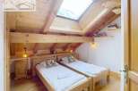 Discover a cozy bedroom with a rustic wooden design.