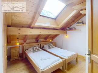 Discover a cozy bedroom with a rustic wooden design.