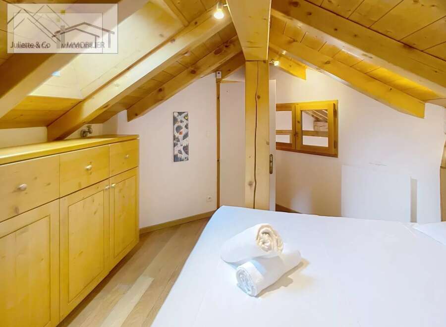Discover a cozy retreat in this charming attic space.