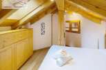 Discover a cozy retreat in this charming attic space.