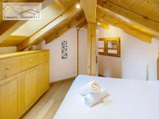 Discover a cozy retreat in this charming attic space.