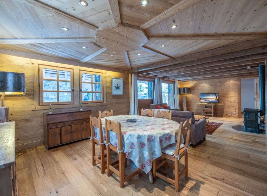 This stunning chalet boasts a beautiful wooden interior with a unique ceiling design.