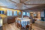 This stunning chalet boasts a beautiful wooden interior with a unique ceiling design.