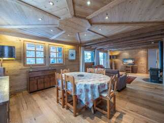 This stunning chalet boasts a beautiful wooden interior with a unique ceiling design.