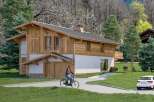 This stunning chalet boasts a unique blend of modern and traditional design, featuring a spacious layout and high-quality finishes.